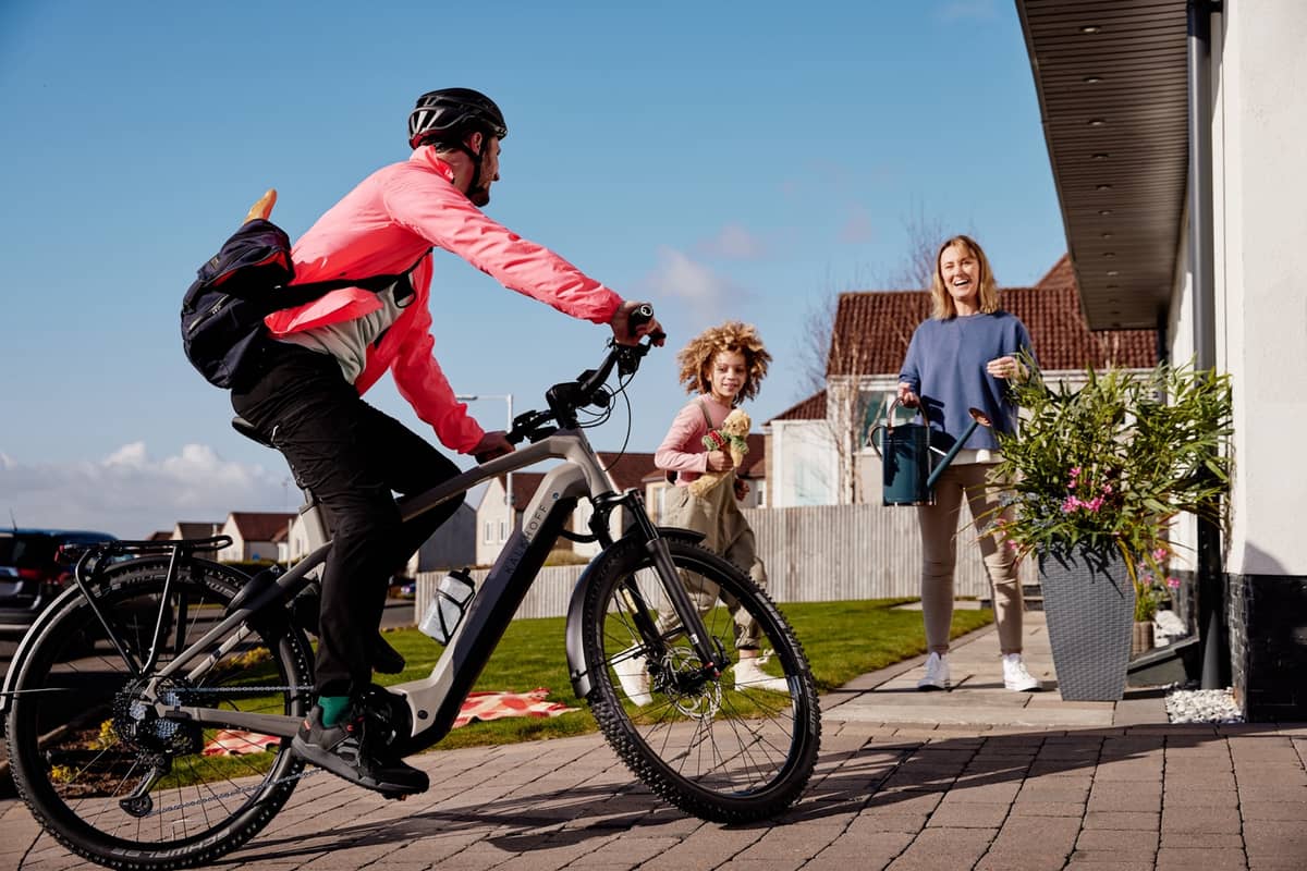 Family man comes home to his wife and child on an e-bike