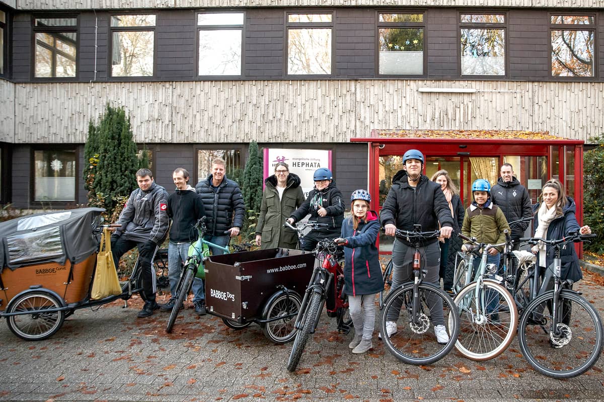 group picture at bike donation for Hephata