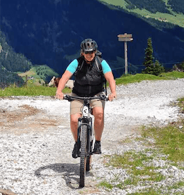 woman on mountainbike in summer in mountainside