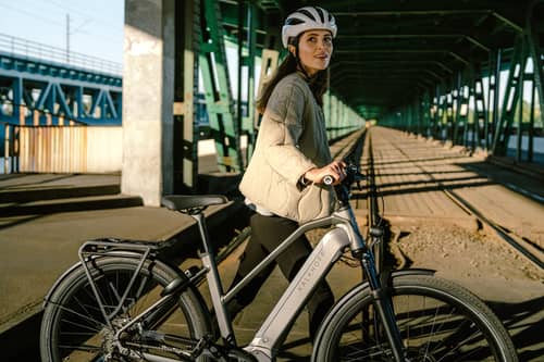 Woman with modern e-bike