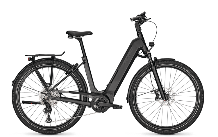 Black Kalkhoff Endeavour 5.B Advance electric bike with fenders, rear rack, and disc brakes on a black background.