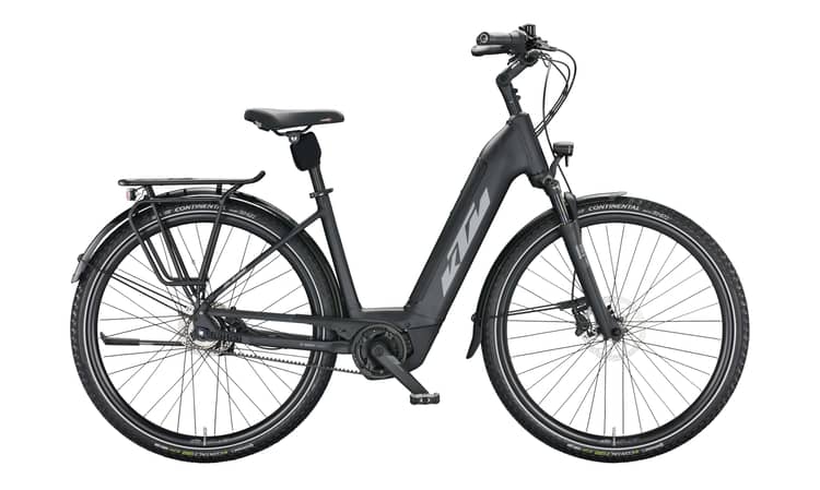 Electric bike KTM Macina City 610 with belt drive and matte grey frame on a white background.