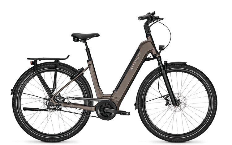"Kalkhoff Image 5B Advance electric bike in brown with rear rack, fenders, and disc brakes on a black background."