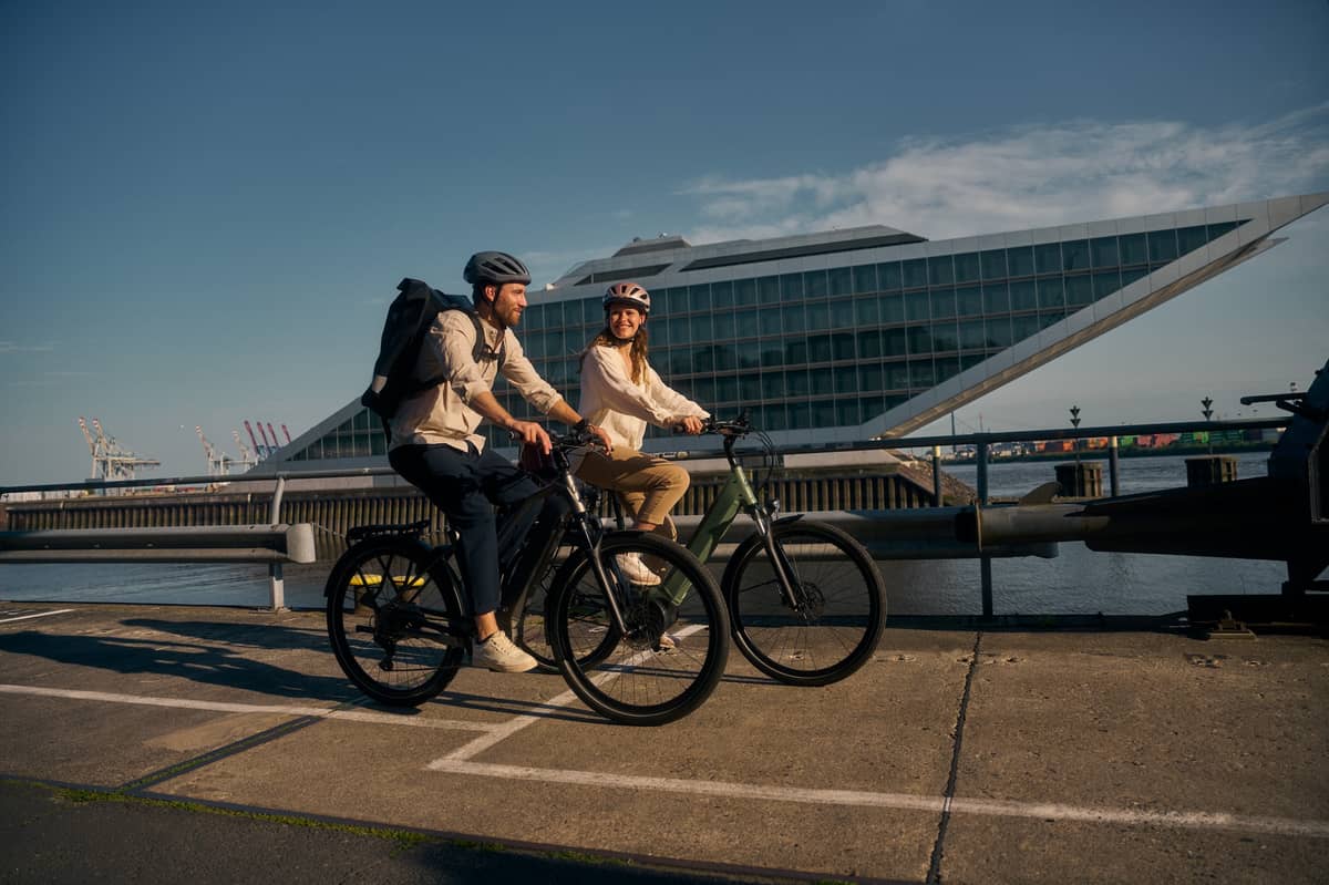 two people on Kalkhoff bikes