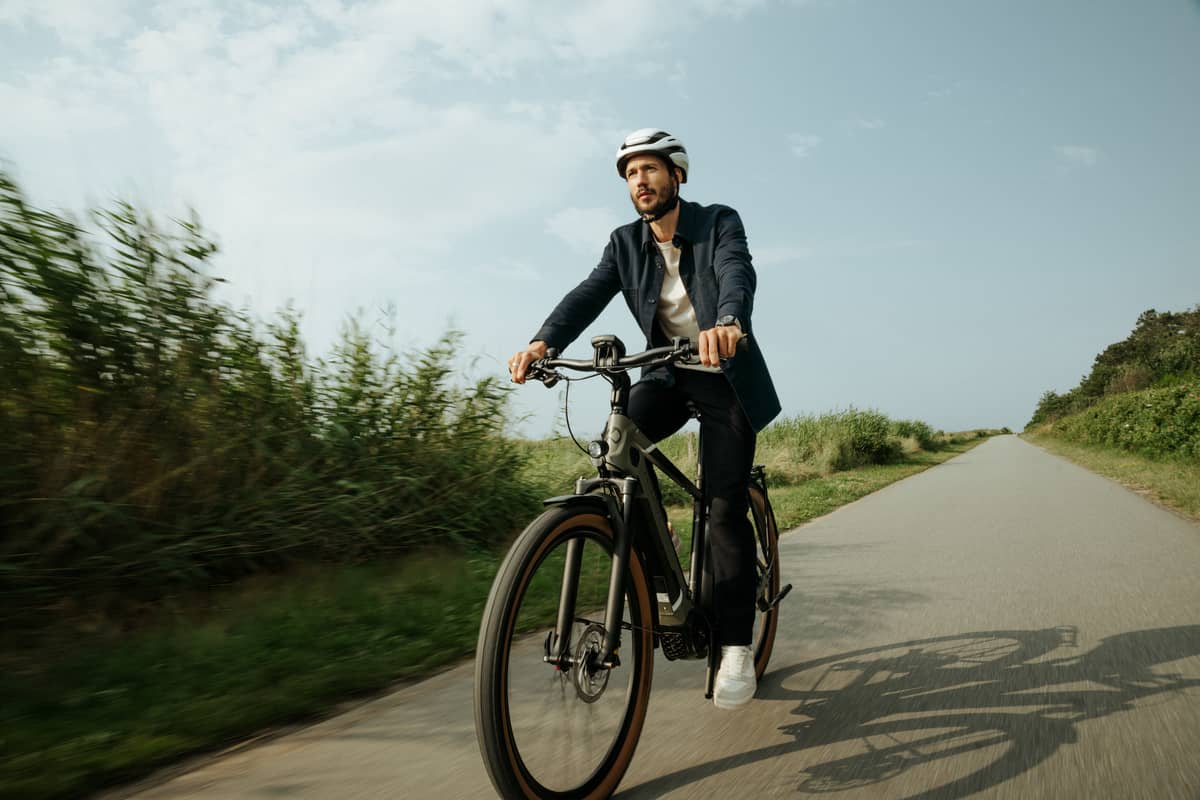 man riding his bike on bike path