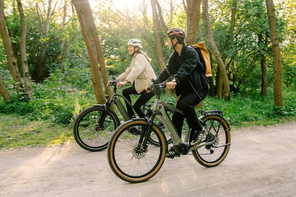 couple riding their bikes through nature