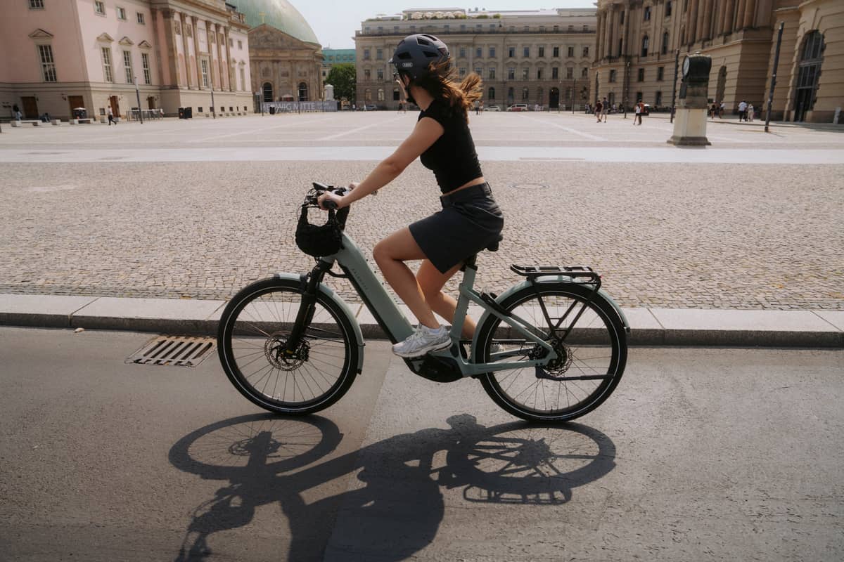 Woman riding job bike in summer