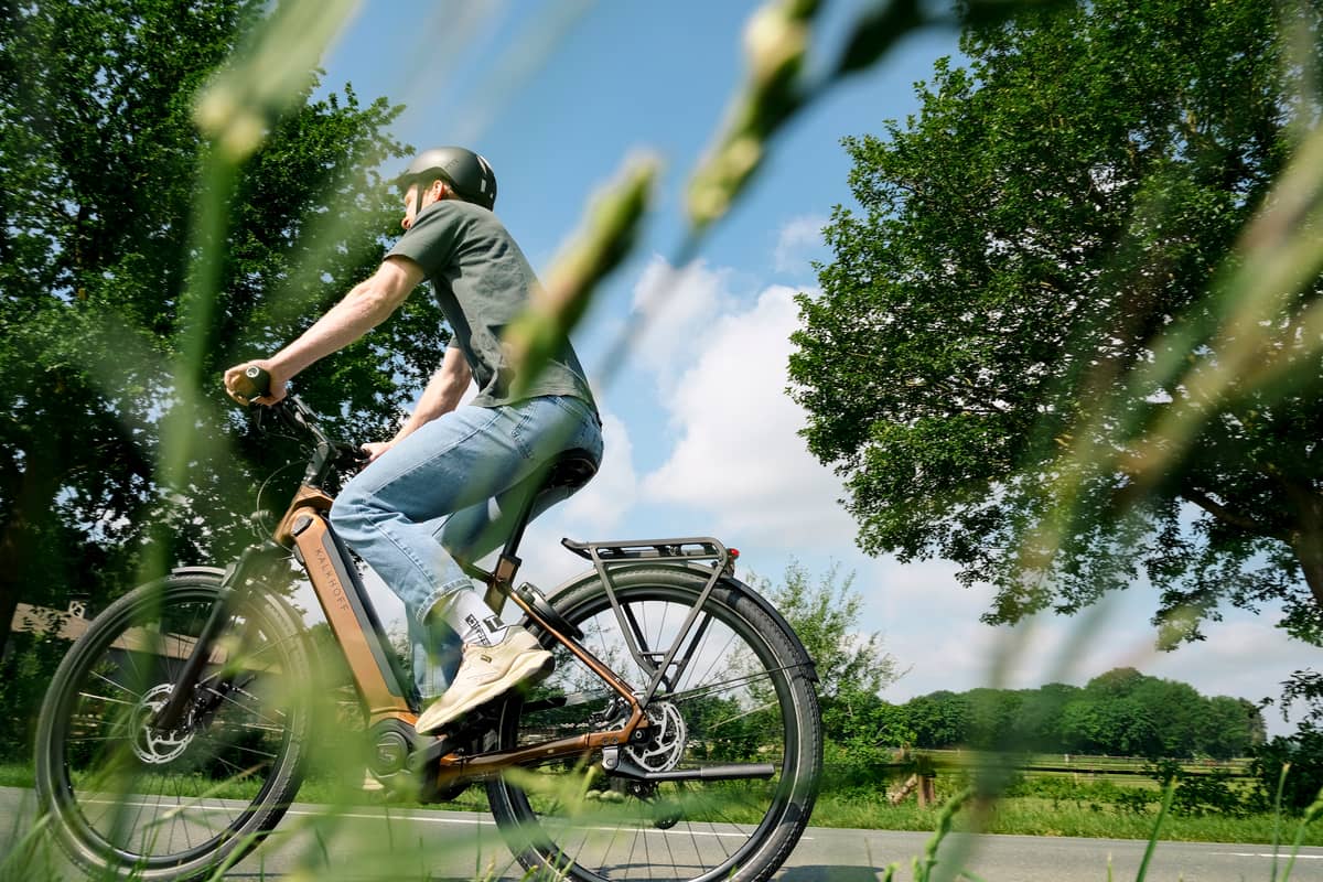 Man riding job bike in summer
