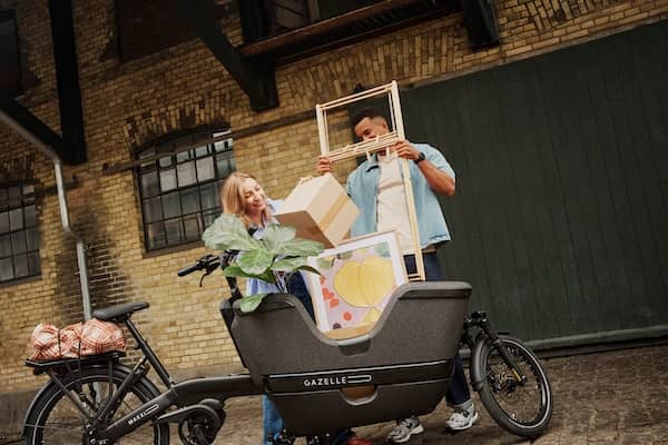 three people on bikes on bike path